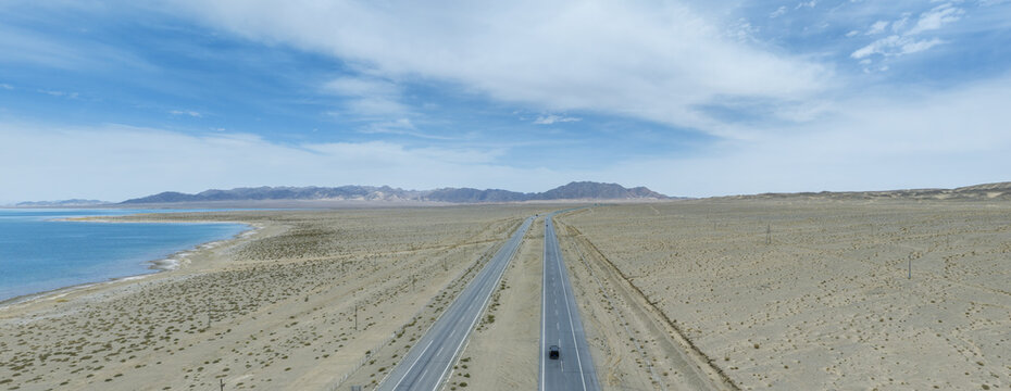 Aerial Panorama Of Highway Beside Xiaochaidan Lake In Qinghai Plateau Desert