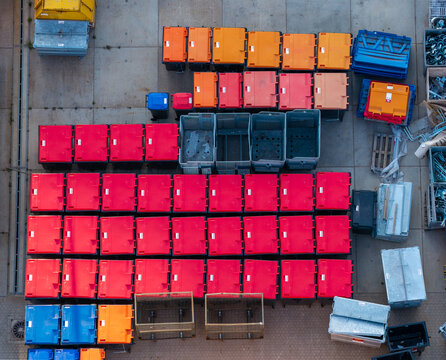 Aerial view of the GP Groot collection and recycling facility featuring rows of colorful waste containers organized in a yard in Alkmaar, Noord-Holland, Netherlands.