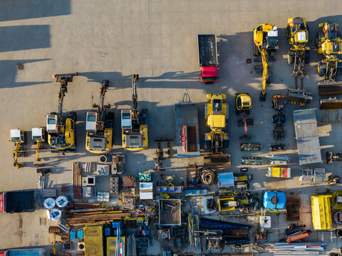 Aerial view of heavy machinery, excavators, and industrial materials at the GP Groot collection and recycling facility in Alkmaar, Noord-Holland, Netherlands.