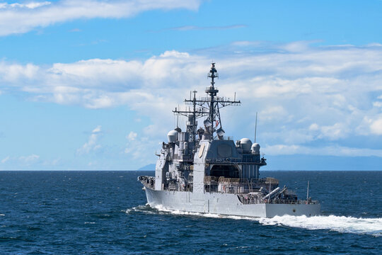 Rear view of US Navy guided missile cruiser underway at sea