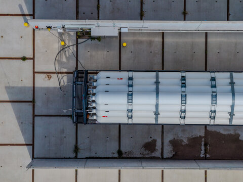 Aerial view of a hydrogen pilot project featuring a truck with white storage tanks for alternative fuel infrastructure in Hoogeveen, Drenthe, Netherlands.
