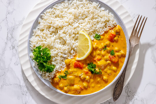 Indian chana masala dish with rice on plate