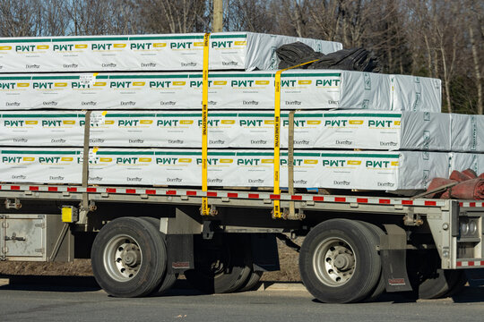 Quebec, Canada, 24 April 2026 : Bundles of PWT I-Joist wood products from Domtar are secured on a flatbed truck for transport.