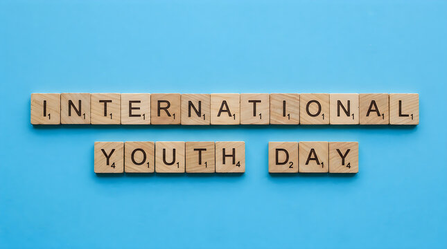 International youth day spelled out with wooden scrabble tiles on a blue background