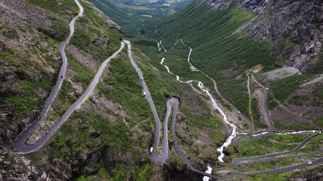 Vehicles driving on Trollstigen switchback road in Norway