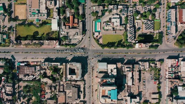 Straight Down Aerial View of City Road Intersection with Mixed Rooftops in Rawalpindi Pakistan