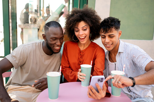 Multicultural group of friends relaxes together, enjoying fun, taking selfie, celebrating diversity