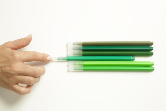 Woman Carefully Arranging Colorful Markers in Perfect Order, Perfectionism and Obsessive Behavior Concept