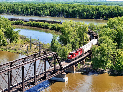 Savanna, Illinois May 14, 2026 Canadian Pacific 2326 Locomotive pulling freight about to cross a Steel Truss Bridge Over the Mississippi River