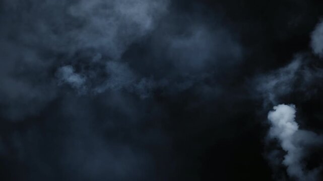 Immersive cinematic Halloween smoke VFX element in 4K slow motion, featuring ethereal swirling mist, mysterious fog clouds and atmospheric haze drifting through darkness for spooky supernatural vfx