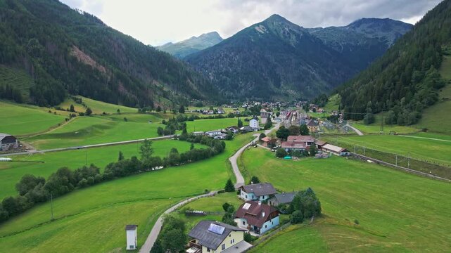 Aerial view of a mountain village in a green valley