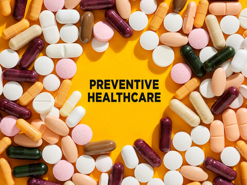 Colorful Pills and Capsules Framing the Words Preventive Healthcare Emphasizing the Importance of Proactive Health Management