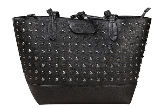 Black leather women tote bag decorated with metal rivets and studs isolated on white background. Stylish female handbag with metal embellishments front view