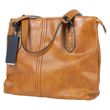 Brown leather women tote bag with shoulder straps and blank tag isolated on white background. Stylish cognac color female handbag with metal rivets