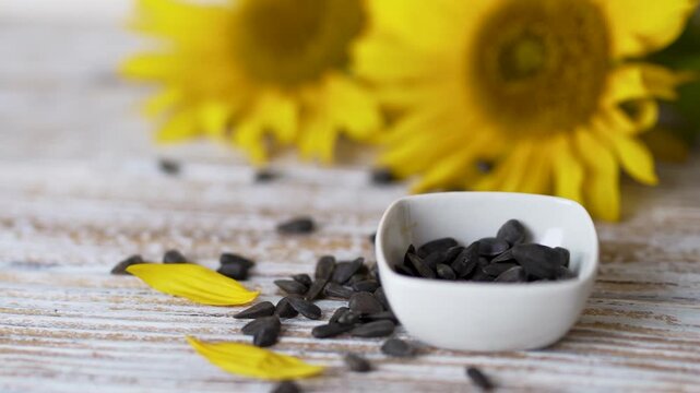Cooking ingredient sunflower seeds with a small spoon stock video