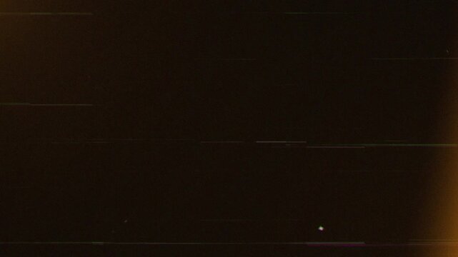 Old damaged tape defects noise, grain, dust, and scratch overlay on black background 4K resolution.