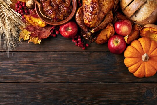 Thanksgiving Rustic Flat Lay with Roasted Turkey Pumpkin Apples Wheat and Copy Space on Dark Wooden Background