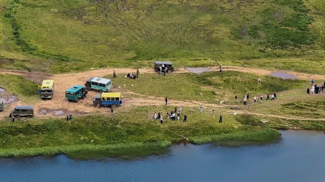 Numerous jeeps and buses carry tourists to Lake Dogyaskab,  Carpathian mountains, Ukraine