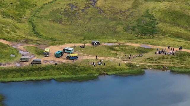 Numerous jeeps and buses carry tourists to Lake Dogyaskab,  Carpathian mountains, Ukraine