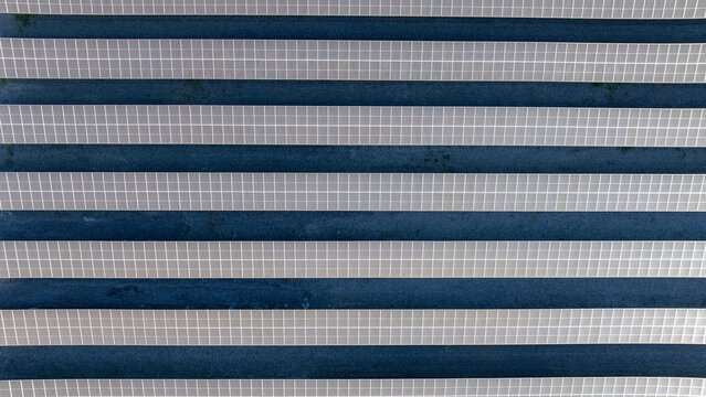 Aerial view of rows of solar panels at a photovoltaic power plant in Itaguai, Rio de Janeiro, Brazil.