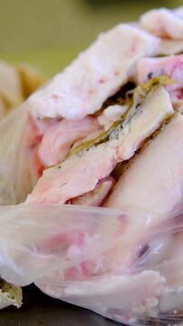 Pork fat trimmings in plastic bag at farmer market after meat processing traditional farm work and food preparation