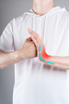 Pain wrist warm-up, close up hand with red backlight. Concept treatment arthritis, gout and inflammation wrist joint in medicine