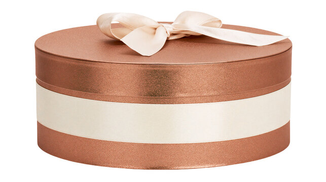 Rose gold round gift box with cream ribbon and bow, isolated on transparent background