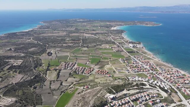 Aerial Drone View over Cesme Coastal Town with Turquoise Aegean Sea and Peninsula, Izmir Turkey