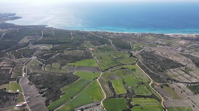 Aerial Drone View of Agricultural Farmland Patchwork Fields with Aegean Sea Coastline, Cesme Turkey