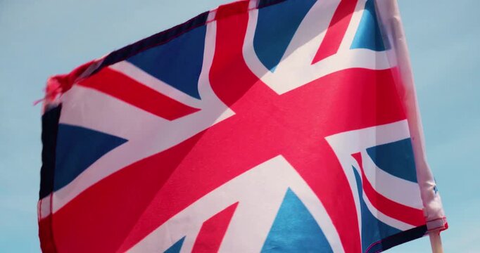 UK British Union Jack flag waving in the wind. National flag of the UK (United Kingdom- England, Scotland, Wales and Northern Ireland) and Canada (called the Royal Union Flag).