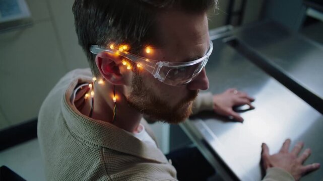 Reacting to electrode pulse, male subject turning right for clinic test, wearing goggles bracing