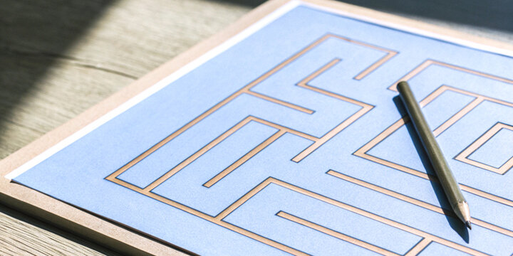 Leader problem solving and decisive decision making with a puzzle maze that has a pencil circle on top