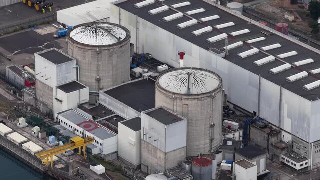 Aerial view of the Fessenheim Nuclear Power Plant with its iconic reactor containment buildings and industrial facilities in Fessenheim, Grand Est, France.