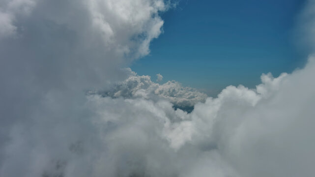 Flying through white fluffy clouds