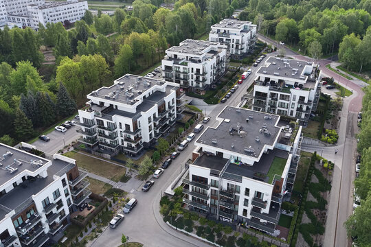 Modern apartment buildings surrounded by green residential landscape