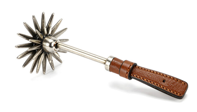 An ornamental metal spur featuring a sharp rotating star rowel and car