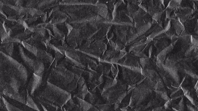 Dark Gray Crumpled Paper Texture with Deep Wrinkled Folds and Rough Surface Background