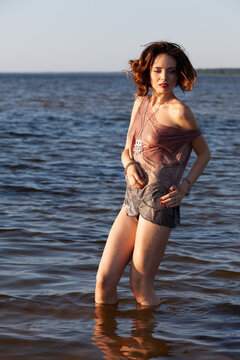 Nude Woman Standing In The Lake