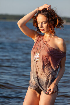Woman wearing wet clothing in water