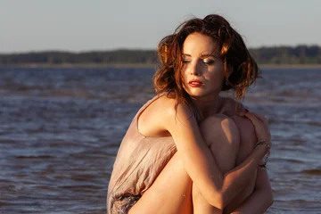 A Woman Sitting In Water © misu