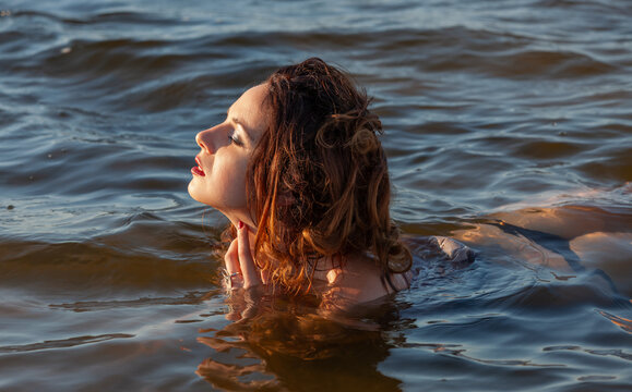 Woman floating in the river water