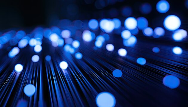 Abstract glow of many thin blue fiber optic strands