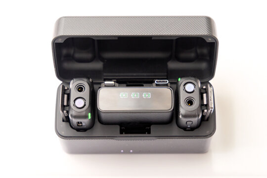 Wireless microphone charging case with transmitters and receiver inside