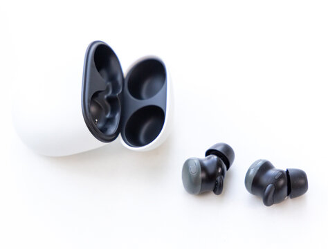 Wireless Earbuds with Charging Case on White Background