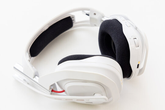 Modern white gaming headset with black padded ear cushions