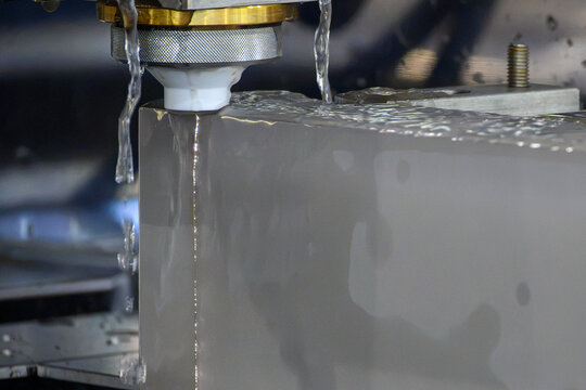 Close up operation of wire EDM machine cutting high thickness metal part