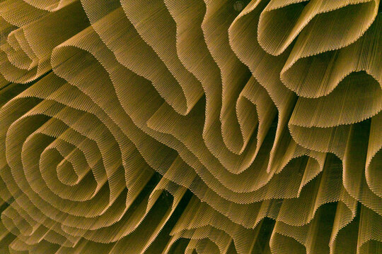 Abstract background, curves and spirals of mesh curtain, interior design element of office building