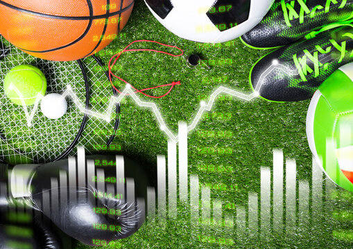 Sports betting tools and equipment displayed on grass with sports data charts