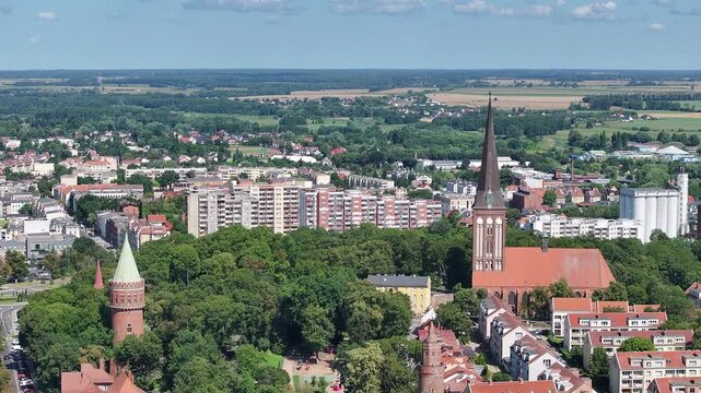 Stargard Poland church city center parks apartments 2. Northern Poland in 8th century. Historical stronghold, defensive walls, gates towers. WW II POW camp controlled by Germany. Brick church.