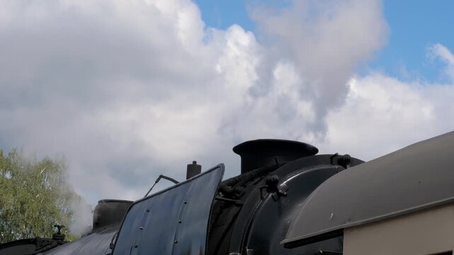 BEEKBERGEN, NETHERLANDS - AUGUST 2026: Detail View of Steam Vapour Released from Locomotive